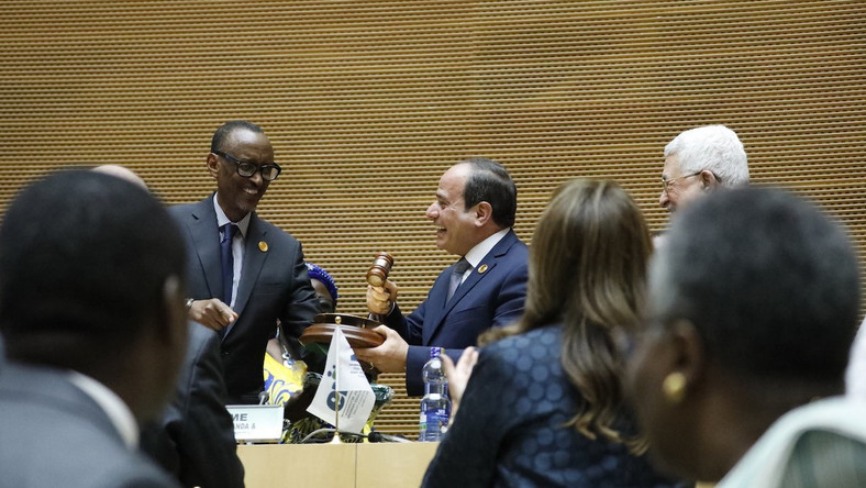 The new African Union Chair receives the baton from his predecessor