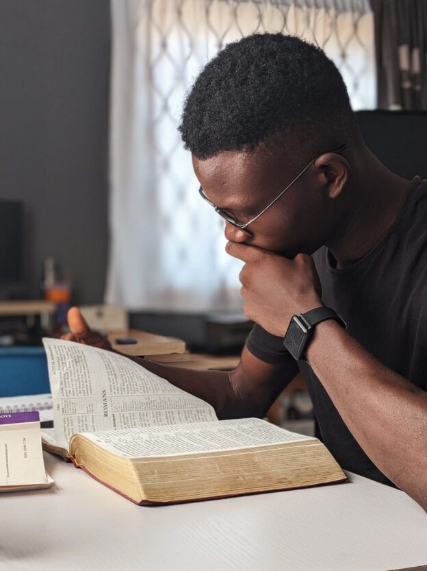 african american man reading a book