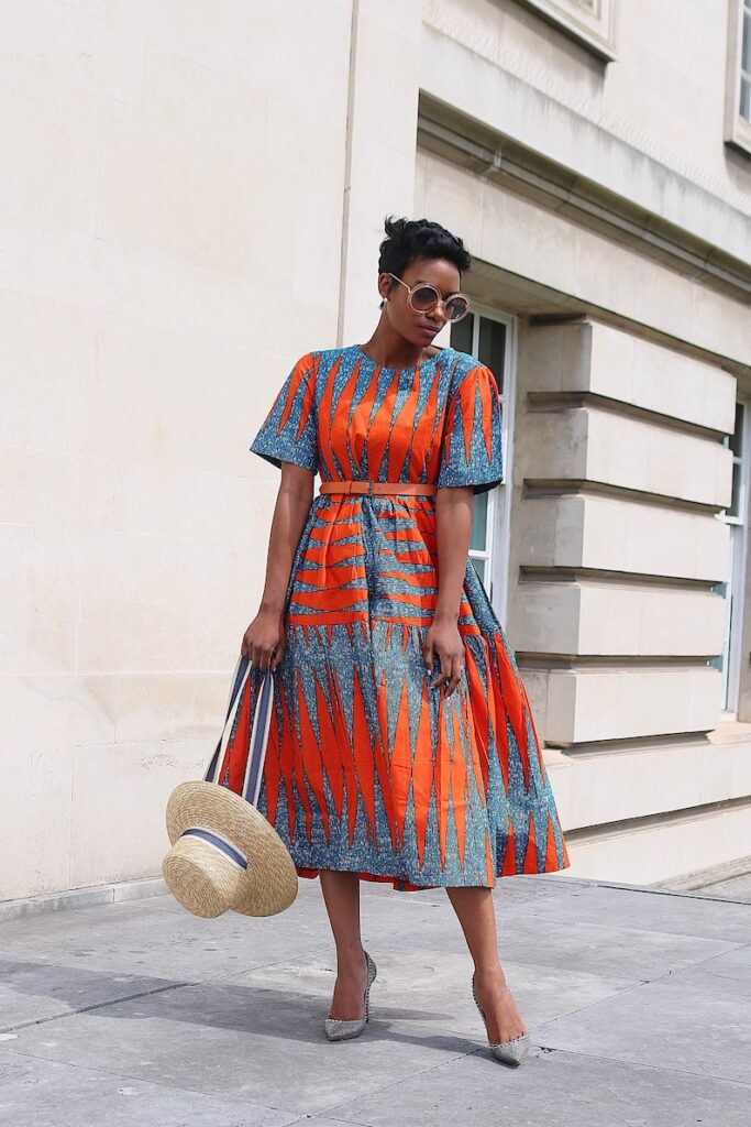A colorful orange Ankara maxi dress
