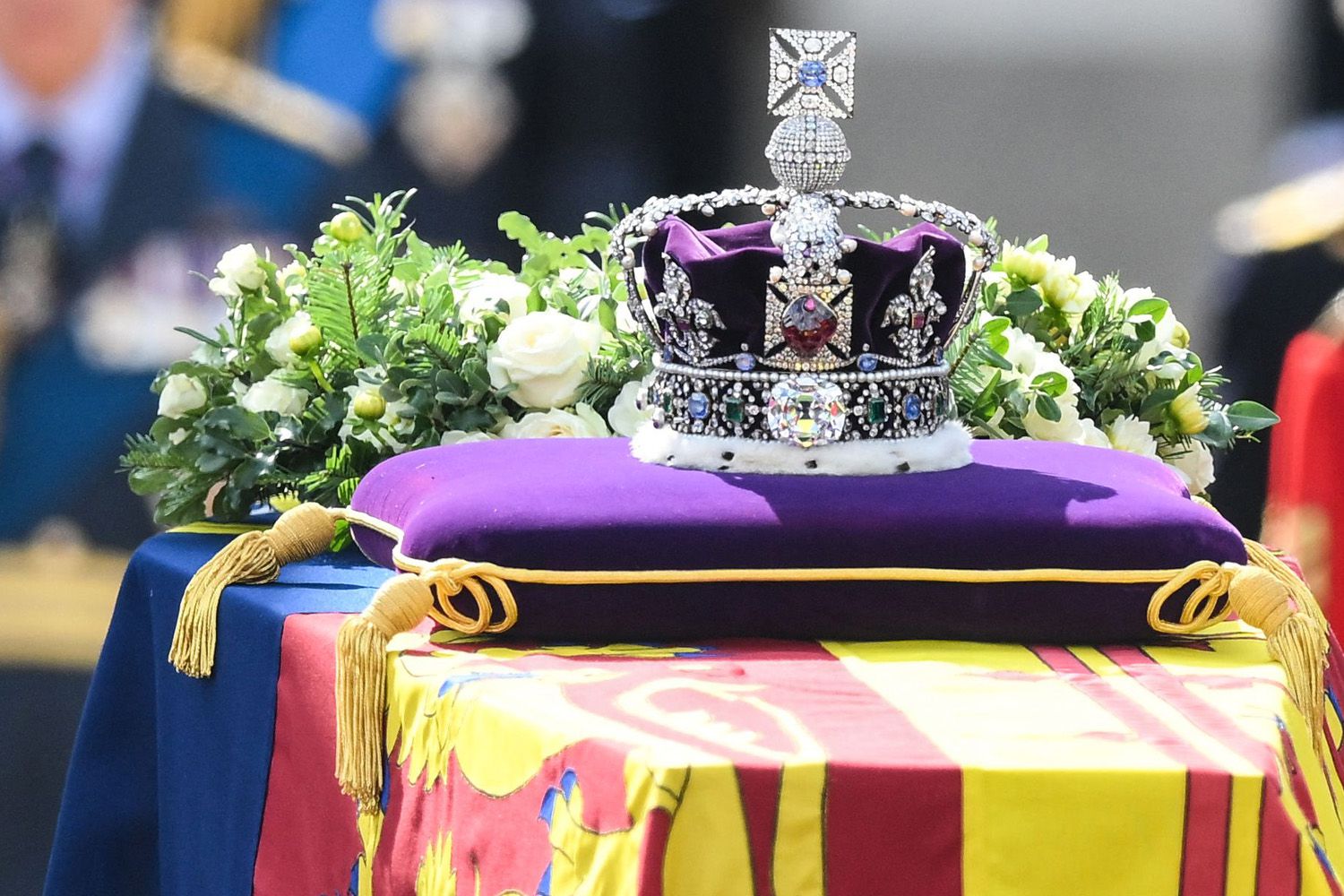 Procession of Queen Elizabeth II's coffin while soldiers salute (Photo credit: New York Post)