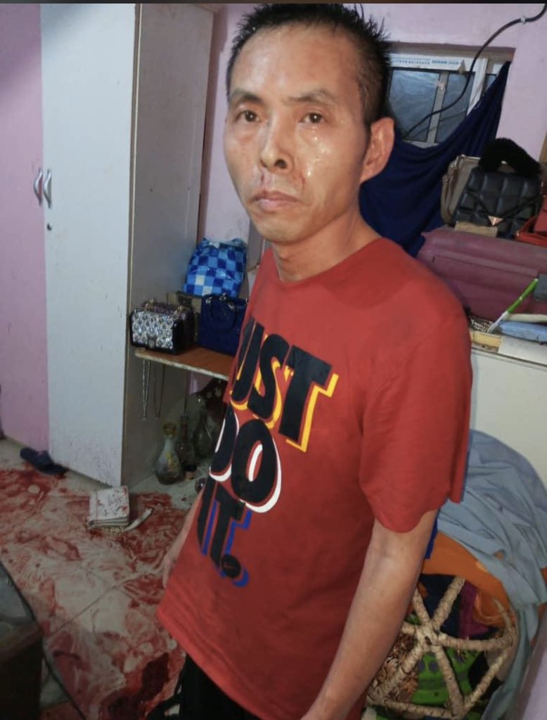 icture of Geng Quarong surrounded by a pool of blood