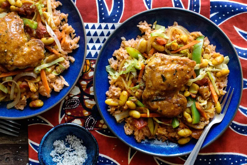 13 Popular African Foods You Cannot Miss In Each Region 2 Soweto chicken chakalaka with West African jollof rice