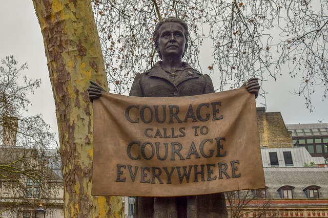 A statue holding a piece of paper with proverb about courage Photo Credit: Millicent Fawcett