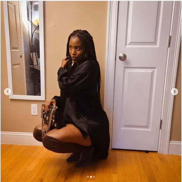 Judicaelle Irakoze in a cute black dress