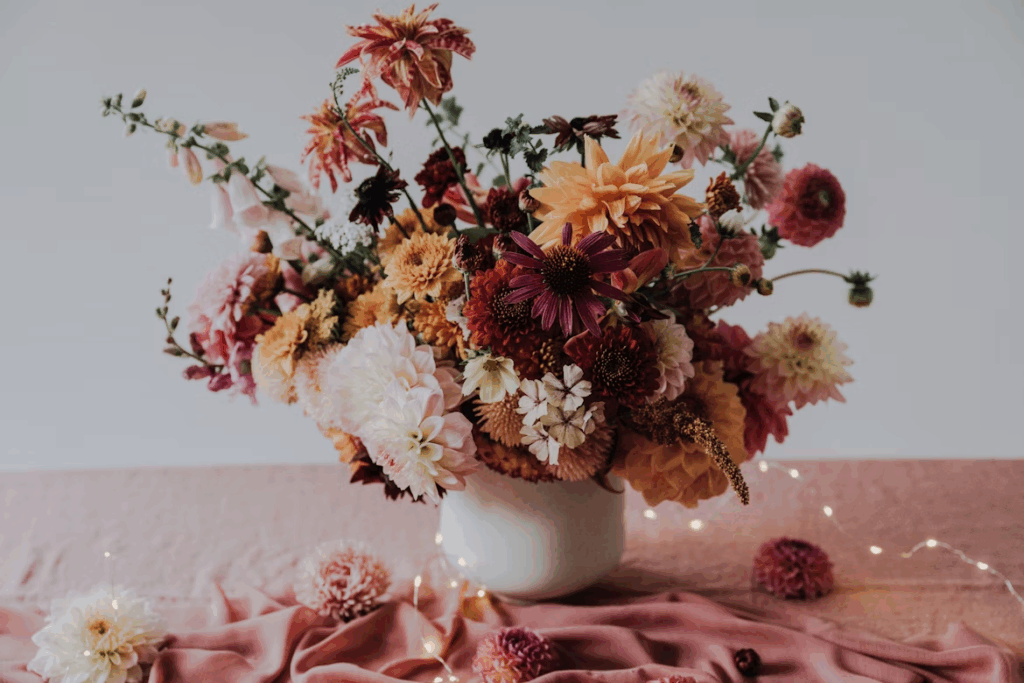 A vase filled with lots of flowers on top of a table. Bouquet for men