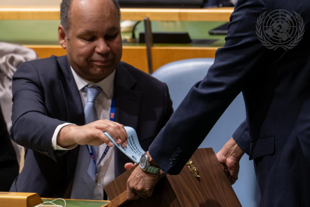  James Kariuki, Acting Permanent Representative of the United Kingdom to the United Nations, casts his vote on Resolution A/80/L.48, Agenda Item 119